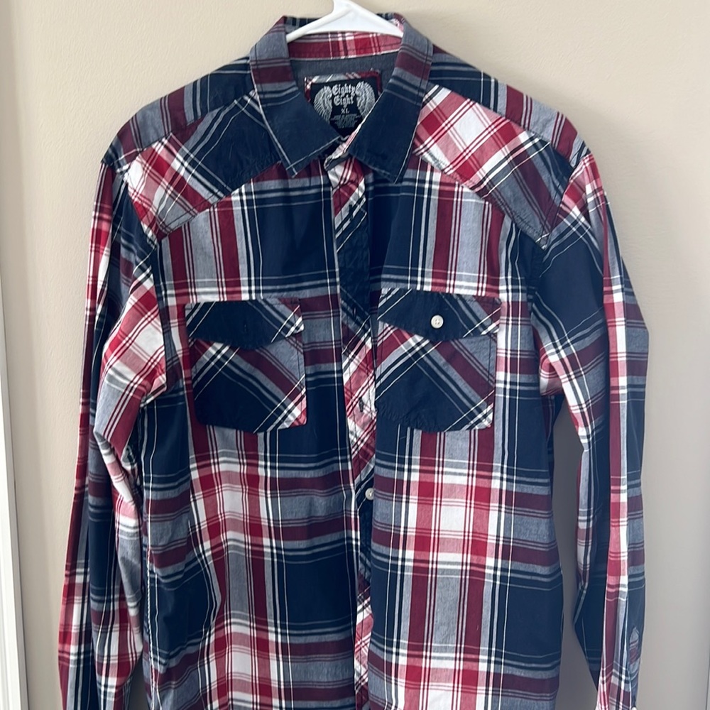 Long sleeved plaid shirt in great shape. Barely worn.